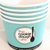 5 Cups · Five branded The Cookie Dough Café cups.