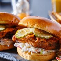 New!: Crispy Asian Chicken Sandwich  · Crispy battered chicken breast topped with spicy sweet chili sauce and jalapeno coleslaw ser...