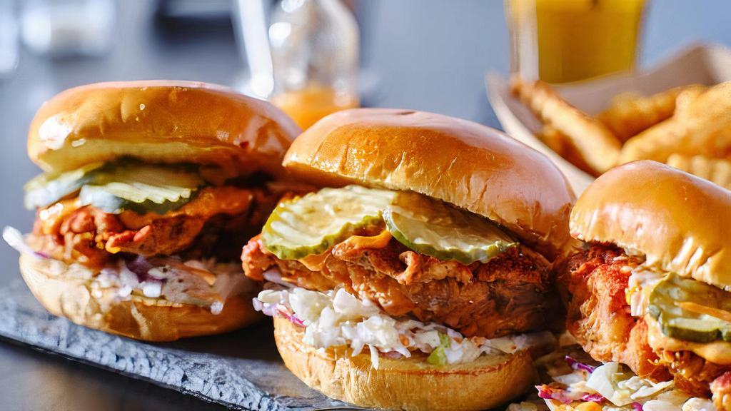 New!: Crispy Asian Chicken Sandwich  · Crispy battered chicken breast topped with spicy sweet chili sauce and jalapeno coleslaw served on a toasted brioche bun.