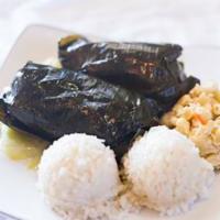 Lau Lau · Traditional Hawaiian dish of pork, chicken, and fish wrapped with banana and taro leaves.