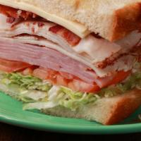 Deli Club Sandwich · Turkey, ham, bacon, white American cheese, lettuce, tomato, onion, and mayo on sourdough bre...