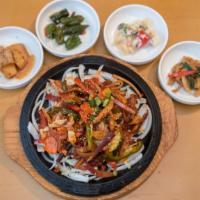 Spicy Squid · Stir-fried squid and vegetables with noodles.