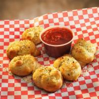 Garlic Knots · These delicious twisted and toasted bread treats are great with our salads, our pizza, or al...