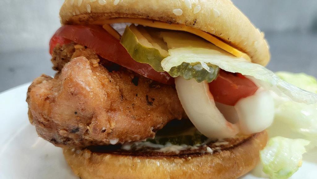 Fried Chicken Sandwich · Fried chicken breast sandwich with cheese, lettuce, tomato, mayo, and pickles