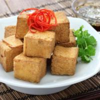 Fried Tofu With Sauce · Tofu fried to perfection and served with delicious dipping sauce.