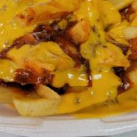 Chili Cheese Fries · Delicious fries topped with green chili and cheese.