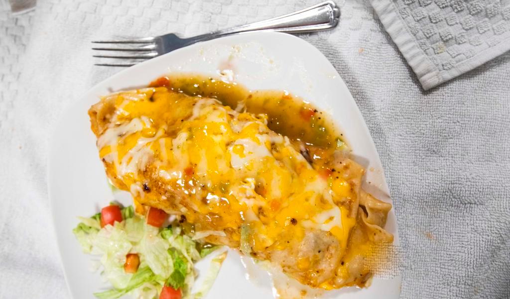 Shredded Beef Burrito · Smothered with green chili. With lettuce, tomato, and cheese.