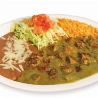 Pork In Chile Verde · Pork cubed cooked in a tomatillo salsa verde. Served with rice, beans and handmade tortillas.