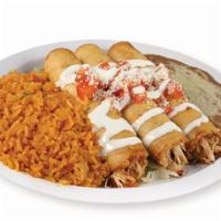 Chicken Flautas · Fried flour tortillas filled with chicken and jack cheese. Flautas topping with tomatoes, me...