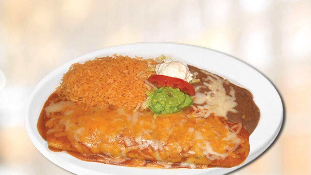 Burrito Plate · Filling with meat choice, beans, onions, cilantro, salsa, jack cheese. covered with enchila sauce,jack and cheddar cheese. Served with rice, beans, lettuce, sour cream and guacamole.