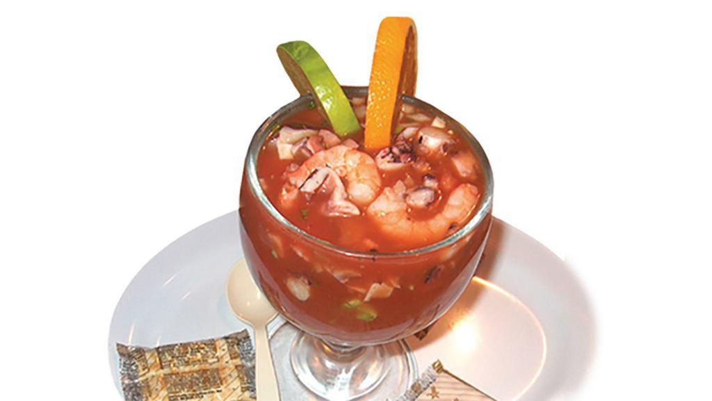 Campechana · Shrimp and octopus in a special shrimp juice, with onions, tomato, cilantro, cucumber and avocado. No extra meat or substitutions without paying or written on special instructions.