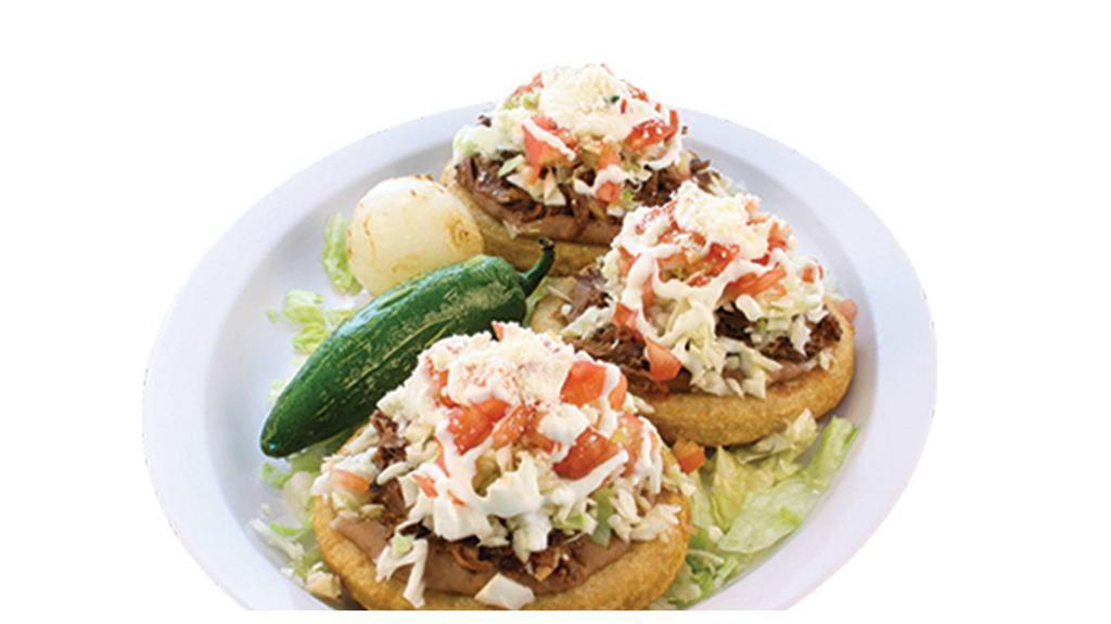 Single Sopito · A handmade corn tortilla spread with beans and topped with meat of your choice, onions, cilantro, salsa, cabbage, tomatoes, Mexican cheese, and Mexican cream. No extra meat or substitutions without paying or written on special instructions.