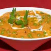 Aloo Mutter+Rice · Potatoes and green peas cooked in a tomato based mildly spicy curry.