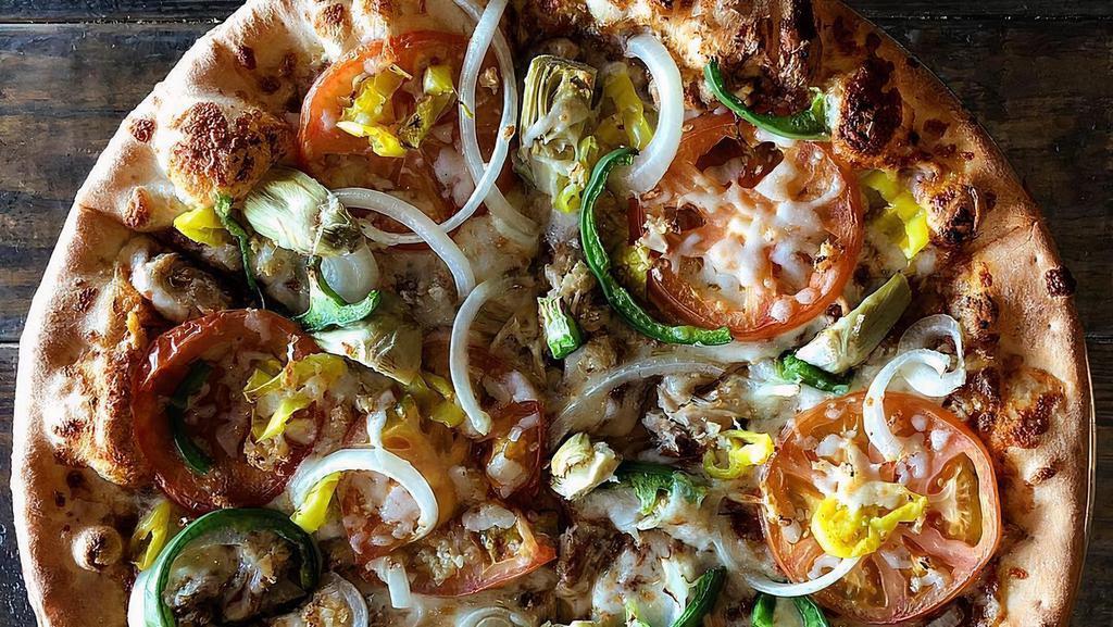 Pizza Vision · Oven roasted chicken, pesto pizza sauce, garden tomato, yellow onion, green pepper, banana pepper, artichoke heart and garlic.