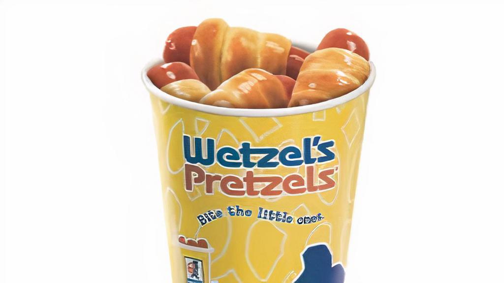 Dog Bites · A whole pile of mini Wetzel dogs, made with mini 100% all-beef hot dogs.