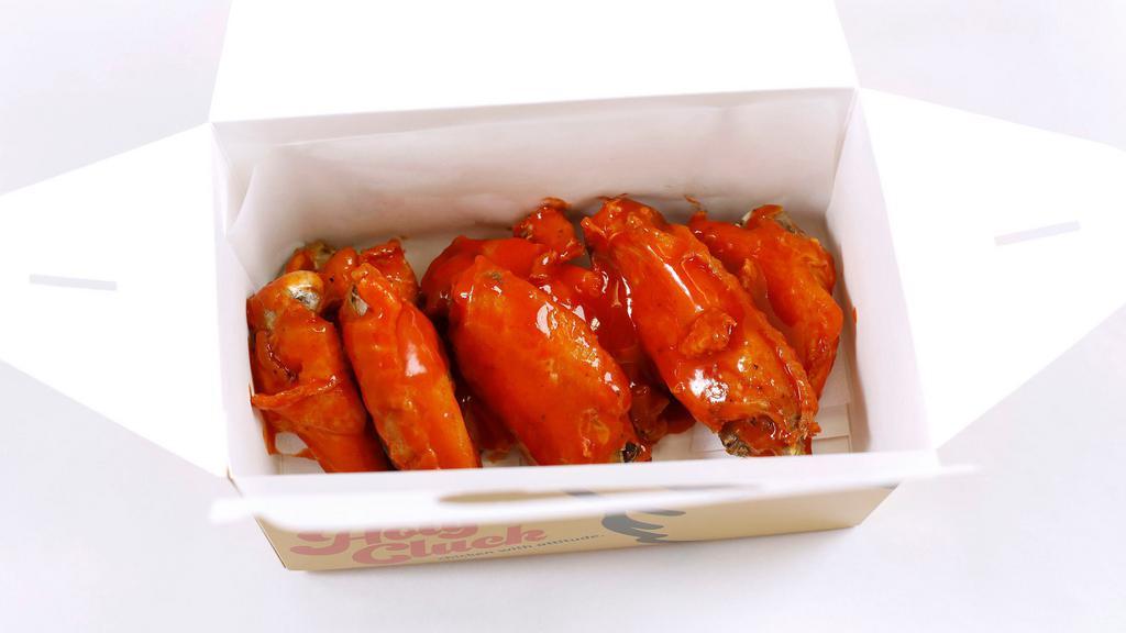 Sriracha Buffalo Wings · Vinegary and sweet. A hot take on a classic.