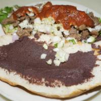Carne Asada Torta · Beef, black beans, lettuce, red mild sauce and pico de gallo (cabbage, tomato, onion and cil...