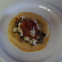 Taco With Carne Asada · Hand made tortilla, pico de gallo (cabbage, tomato, onion and cilantro) and red mild sauce.