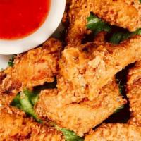Chicken Wings (6) · Traditional bone-in fried wings serve with sweet chili sauce on the side.