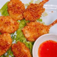 Coconut Butterfly Shrimp (6) · 6 Fried shrimps in shredded coconut breadcrumbs. Served with sweet chili sauce and lettuce. ...
