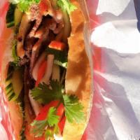 Banh Mi -Vietnamese Sandwich · Choice of grilled chicken, pork, beef or combo smeared with mayo sauce and topped with pickl...