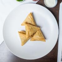 Veggie Samosa (4 Pieces) · Vegan. Famous savory fried pastries of sub-continent with potatoes, green- peas filling.