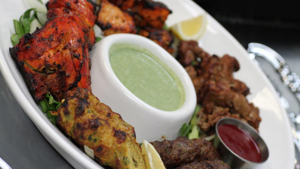 Mixed Kabob Platter · Served without rice. Heavenly platter of all our kabobs; chicken tandoori, seekh kabobs, boti kabobs, bihari kabobs, served with raita.