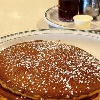 Buttermilk Pancakes (Short) · Homemade with whipped butter and warm maple syrup.