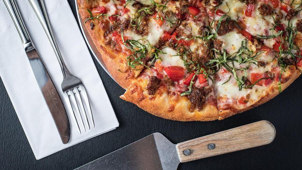Sausage & Red Peppers · Red sauce, house made sausage, garlic, basil, mozzarella, & roasted peppers.