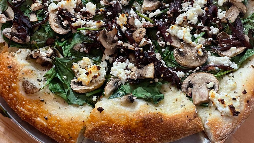Shroomy Goat · Olive oil & herb crust, goat cheese, mushroom, arugula & spinach, caramelized onions. This pizza does not have pizza sauce or mozzarella.