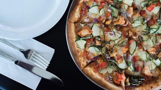 Chicken Thai Curry Pizza · Red curry sauce, red peppers, onion, cilantro, and zucchini with chicken & mozzarella.
Sauce contains soy, pineapple, and coconut milk