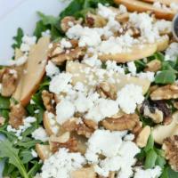 Apple, Walnut & Goat Cheese · Served over spinach and arugula ~ with our honey poppy-seed dressing.