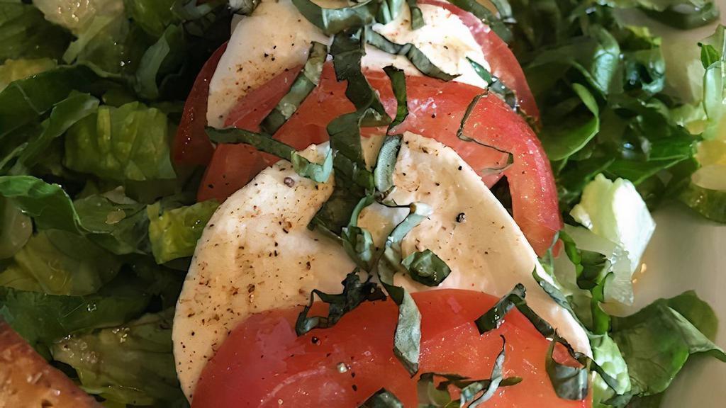 Caprese (Gf) · Chopped romaine, tomato, and fresh mozzarella~ dressed with extra virgin olive oil, and balsamic vinegar. Gluten-free.