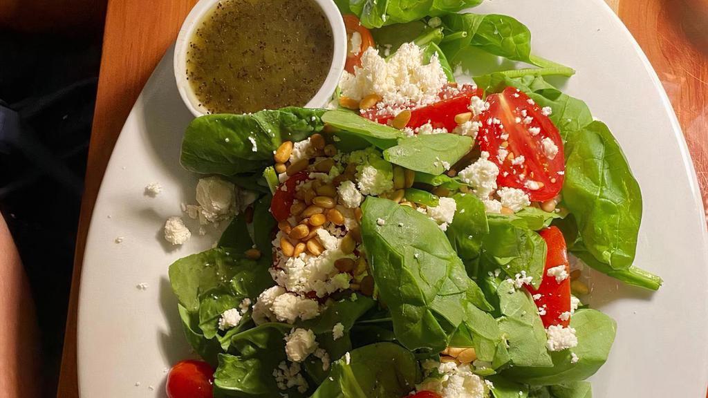 Spinach (Gf) · Baby spinach, roasted pine nuts, tomato, feta, with our honey poppy-seed dressing. Gluten-free.