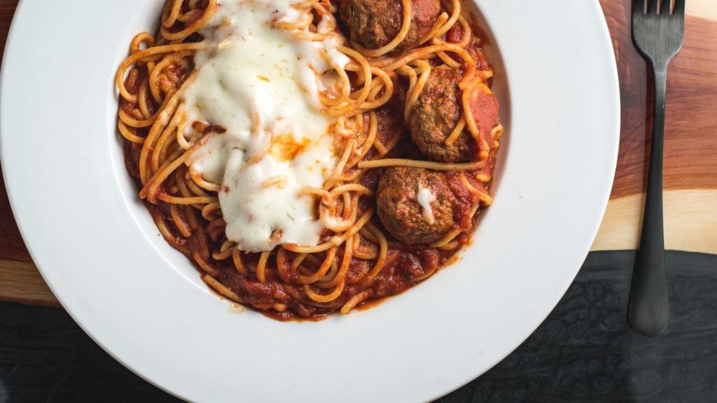 Spaghetti · Organic pasta and marinara topped with mozzarella and baked. $22.50 with meatballs as shown here, must select meatballs or it is vegetarian and $15.50