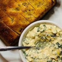 Homemade Spinach & Artichoke Dip · Creamy cheese blended with organic fresh spinach and tomatoes, garlic, and artichoke hearts....