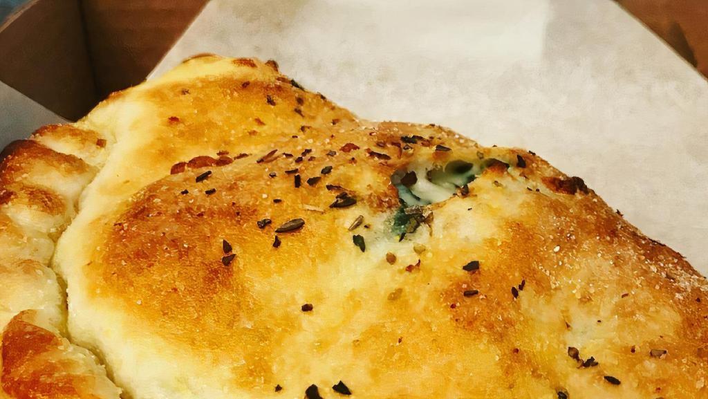 Make It A Calzone · Choose up to three toppings (see above), served with ricotta, mozzarella, and marinara.
You may sub vegan cheese for no additional charge.