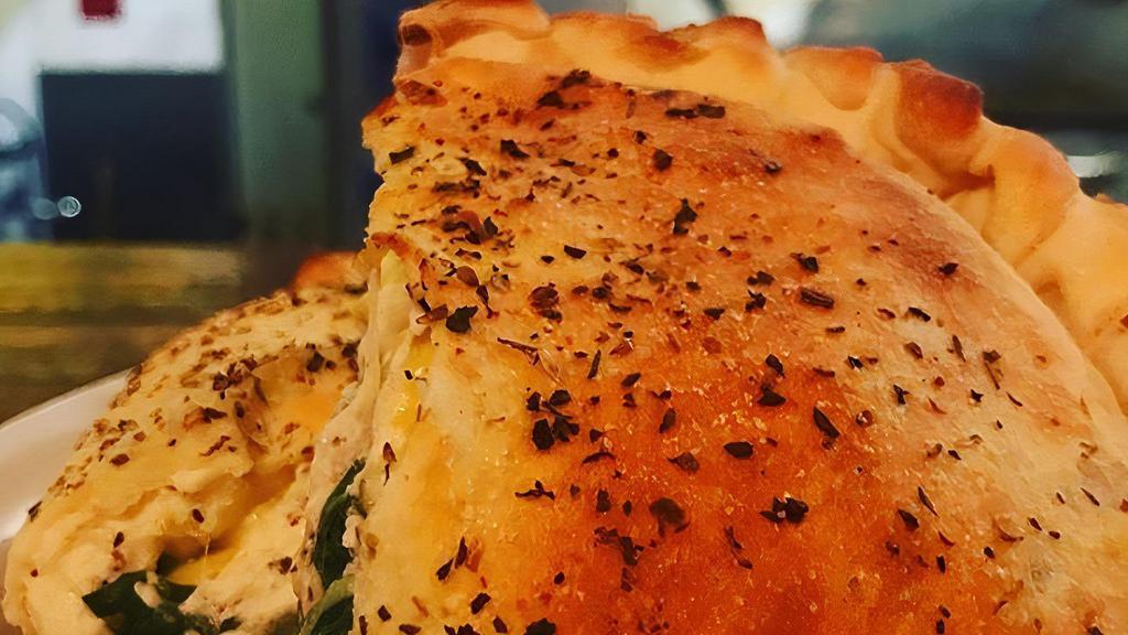 Spinach Dip Calzone · Our creamy spinach and artichoke dip with baked chicken and house-roasted green chilies (no substitutes please). As seen on food networks 