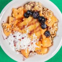 Melon Bowl · Cantaloupe, hemp granola, apple sauce, coconut, blueberries, agave syrup