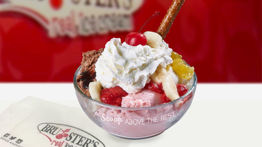 Banana Split · Traditional-One scoop of freshly made vanilla, strawberry and chocolate ice cream topped with a banana, chocolate, pineapple and strawberry topping. Whipped cream, cherry and pretzel stick.