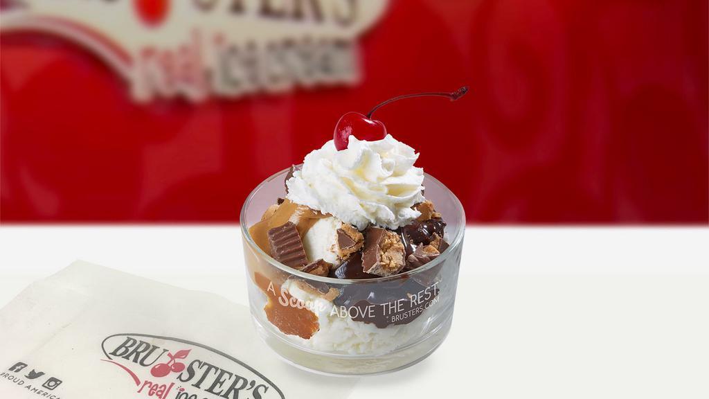 Peanut Butter Cup · Two scoops of freshly made vanilla ice cream topped with hot fudge, warm peanut butter, chopped Reese's peanut butter cups, whipped cream and cherry.