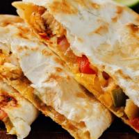 Loaded Quesadilla · Braised chicken, bacon, cheddar jack,
grilled onions & peppers, sour cream, salsa