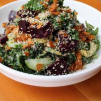 Beet Crunch Salad · Roasted beets, Coconut Bacon, Pecans, Massaged kale, Pickled celery, and Cucumbers tossed in...
