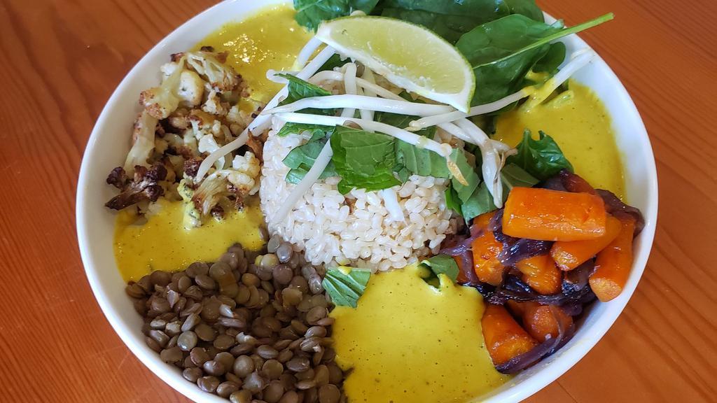 Golden Dragon Bowl · Roasted Cauliflower, Roasted Onions & Carrots, Green Lentils, Brown Rice, Fresh Spinach & Herbs, Peanuts & Lime, In a Turmeric- Garlic Coconut Curry