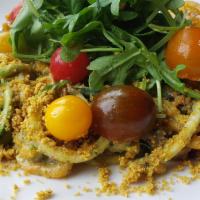 Zucchini Pesto Pasta · Zucchini Noodles, Basil~Pecan Pesto, Cherry Tomatoes, Hazelnut Parm, Cashew Cream, Lemon Zes...