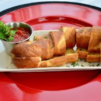 Garlic Bread - Full Sized Order · Toasted bread roll with garlic herb butter.