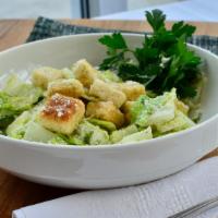 Side Caesar Salad · Romaine, croutons, Caesar dressing, and Parmesan cheese.