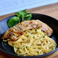 Linguine Chicken Alfredo · Linguine pasta, grilled Italian herb chicken breast, creamy Alfredo sauce, Parmesan,  topped...