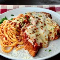 Chicken Parmesan · Breaded and fried chicken breast, house-made marinara, melted mozzarella, served with a side...