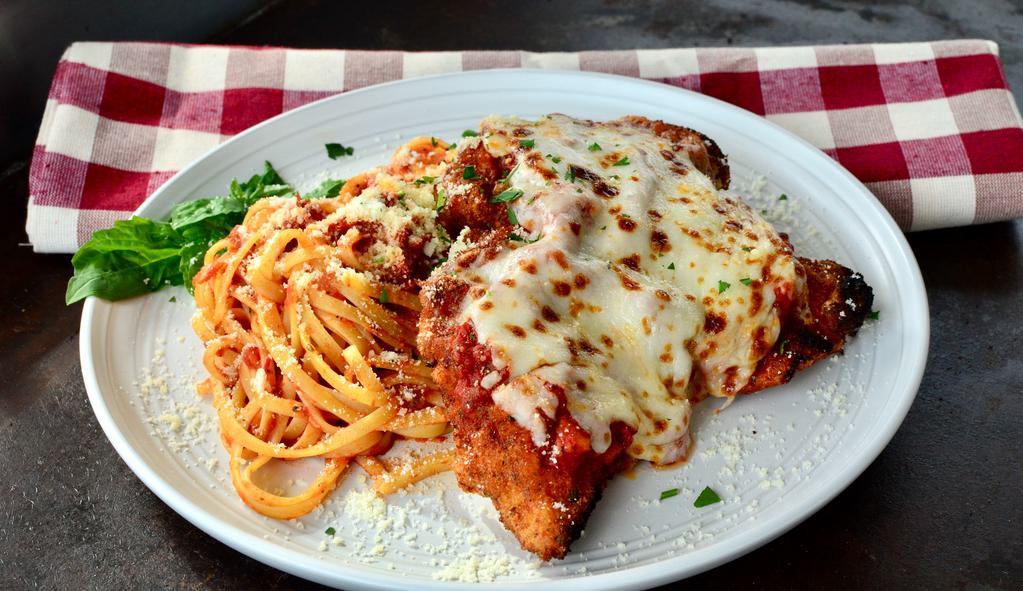 Chicken Parmesan · Breaded and fried chicken breast, house-made marinara, melted mozzarella, served with a side linguine and marinara sauce.